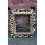 A 19TH CENTURY GILTWOOD FLORENTINE STYLE PICTURE FRAME, of rectangular outline, rebate 45 x 37 cm