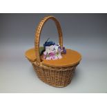A VINTAGE LADIES WICKER BASKET HANDBAG WITH FLORAL EMBELLISHMENT, of oval form, wicker body and han