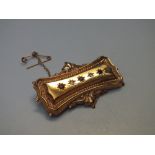 A HALLMARKED 9CT GOLD EDWARDIAN STYLE DIAMOND AND RUBY SET BROOCH, W 5 cm