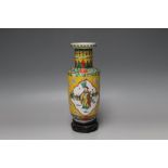 A CHINESE YELLOW GROUND VASE, circa 19th century on wooden stand with four character mark to base,