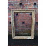 A 19TH CENTURY CARVED GILT WOOD FRAME, of rectangular form, with carved foliate detail, picture reb