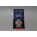 A CASED SILVER PAPAL MEDAL, coming in an embossed red Morocco case with spring action holder system