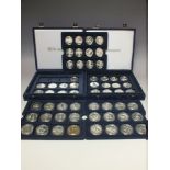 A LARGE COLLECTION OF FIFTY SEVEN SILVER PROOF AND OTHER COMMEMORATIVE COINS RELATING TO WORLD WAR