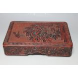 A CHINESE CINNABAR LAQUER BOX, decorated with a bird flying around a flower with floral detail to