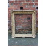 A 19TH CENTURY GILTWOOD PICTURE FRAME, of rectangular outline, rebate 80 x 66 cm