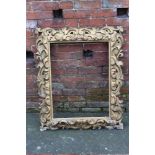 A 19TH CENTURY GILTWOOD FLORENTINE STYLE PICTURE FRAME, of rectangular outline, rebate 71.5 x 54 cm