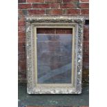 A GILTWOOD PICTURE FRAME, of rectangular outline, with broken glass, rebate 85 x 53 cm A/FC