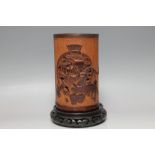 A CHINESE BAMBOO BITONG BRUSH POT, on hardwood stand, H 22.25 cm inc stand