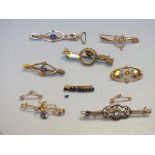 A COLLECTION OF 9CT GOLD AND YELLOW METAL BAR BROOCHES, to include gemset example, various marks an