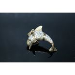 A HALLMARKED 9CT GOLD ARTICULATED DOLPHIN PENDANT, set with white stones, approx weight 24 g