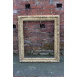 A 19TH CENTURY CARVED GILTWOOD PICTURE FRAME, of rectangular outline, rebate 74 x 60 cm