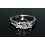 A 14 CARAT WHITE GOLD DIAMOND RING, set with three Princess cut diamonds totalling approx 0.95 cara