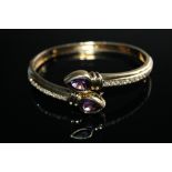 A TEARDROP AMETHYST AND DIAMOND BANGLE, set with two teardrop amethysts of approx 2 carats each, w