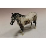 A SPECKLED ROYAL DOULTON GLAZED HORSE FIGURE