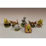 A COLLECTION OF SEVEN ROYAL DOULTON WINNIE THE POOH FIGURES - BOXED