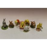 A COLLECTION OF EIGHT ROYAL DOULTON WINNIE THE POOH FIGURES - BOXED