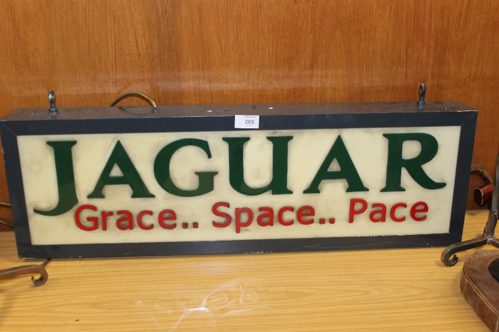 A VINTAGE ILLUMINATING JAGUAR 'GRACE...SPACE...PACE' ADVERTISING SIGN