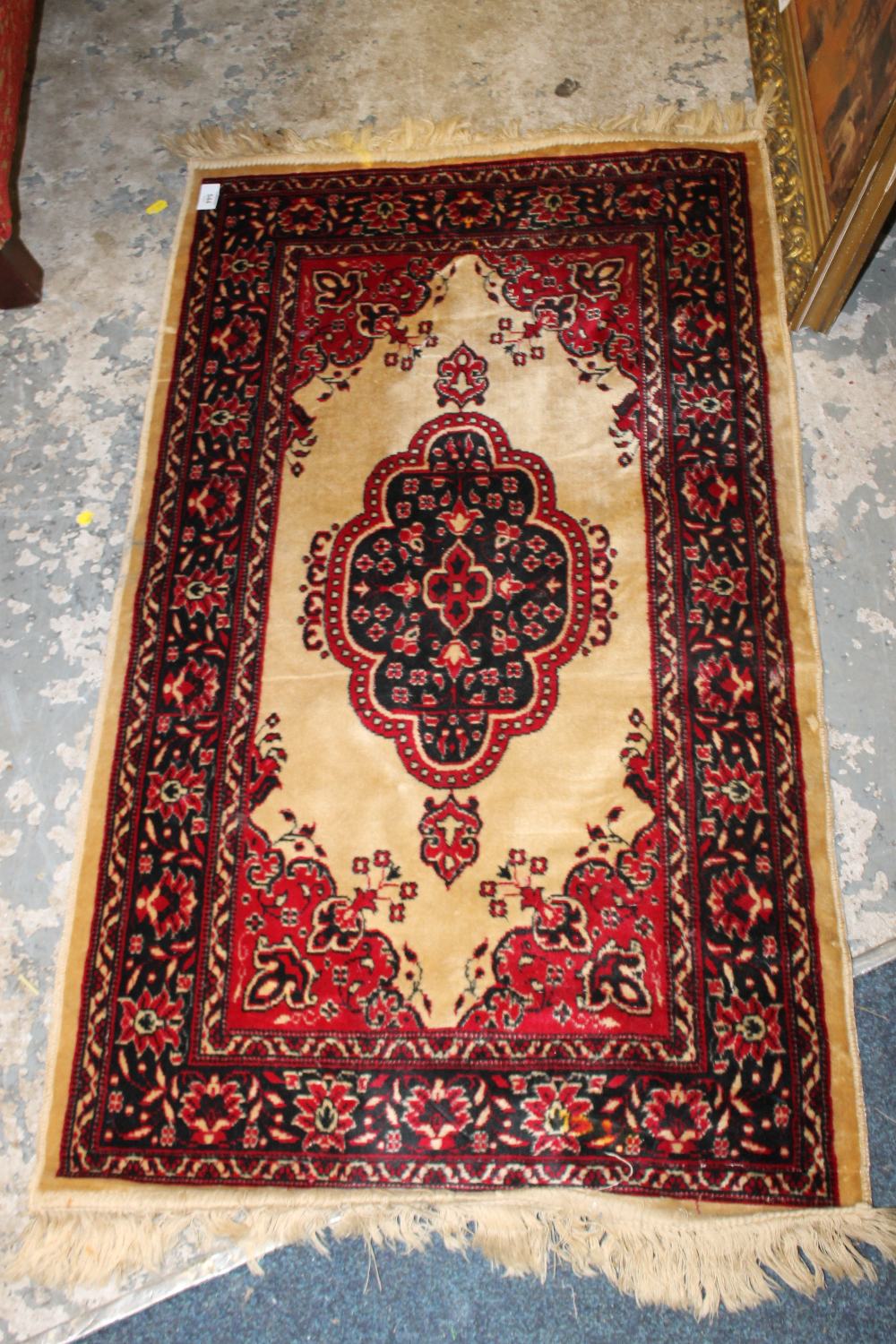 A SMALL SILK RUG