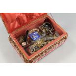 A VINTAGE SEWING BASKET CONTAINING COSTUME JEWELLERY