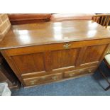 A 19TH CENTURY OAK MULE CHEST, the hinged lid above a three panel front with two small drawers