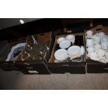 FOUR TRAYS OF ASSORTED CHINA, GLASSWARE, CUTLERY AND TRAYS TO INCLUDE LARGE GLASS GOBLETS