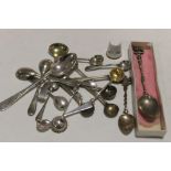A BAG OF SILVER AND WHITE METAL CONDIMENT SPOONS ETC