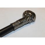 A CHROME SKULL TOPPED WALKING CANE