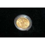 A CASED 1915 HALF SOVEREIGN