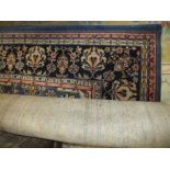 A LARGE WOOLLEN RUG, floral pattern to the centre, mainly blue ground, approximately 450 cm x 275