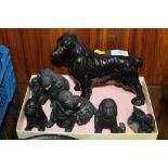 NINE BLACK SPANIEL FIGURES