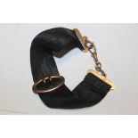 AN UNUSUAL 9CT GOLD BELT BRACELET