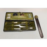 AN ANTIQUE SEWING KIT AND A PAGE TURNER