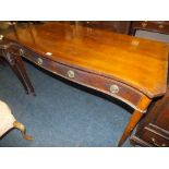 A 19TH CENTURY MAHOGANY SERPENTINE SHAPED SERVING TABLE WITH TWO DRAWERS, W 137 cm