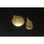 A CIRCULAR LOCKET STAMPED '18CT' PLUS ANOTHER