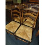 A SET OF FOUR OAK WICKER SEAT CHAIRS