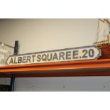 A WOODEN ALBERT SQUARE E.20 SIGN