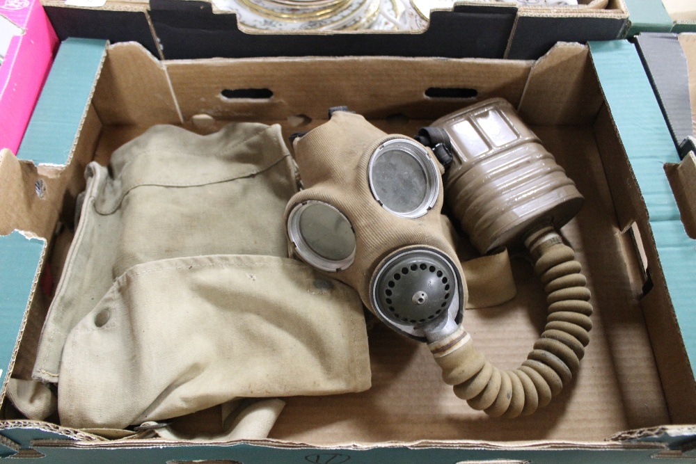 A RARE WWII BRITISH GAS MASK, CANVAS COVERED MASK AND TAN COLOURED FILTER, WITH 1941 DATED BAG AND