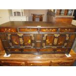 AN UNUSUAL OAK CHINESE STYLE LOW CABINET WITH PAINTED DECORATION