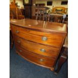 A 19TH CENTURY BOW FRONTED CHEST OF THREE DRAWERS