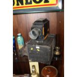 A LARGE VINTAGE MAGIC LANTERN BY LANCASTER AND SONS OF BIRMINGHAM WITH CASE AND SLIDES