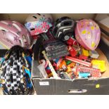 A TRAY OF CHILDS TOYS AND HELMETS ETC.