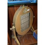 A VINTAGE BRASS ELECTRIC HEATER