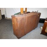 A VINTAGE LEATHER SUITCASE