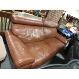 A MODERN BROWN LEATHER THREE SEATER SOFA