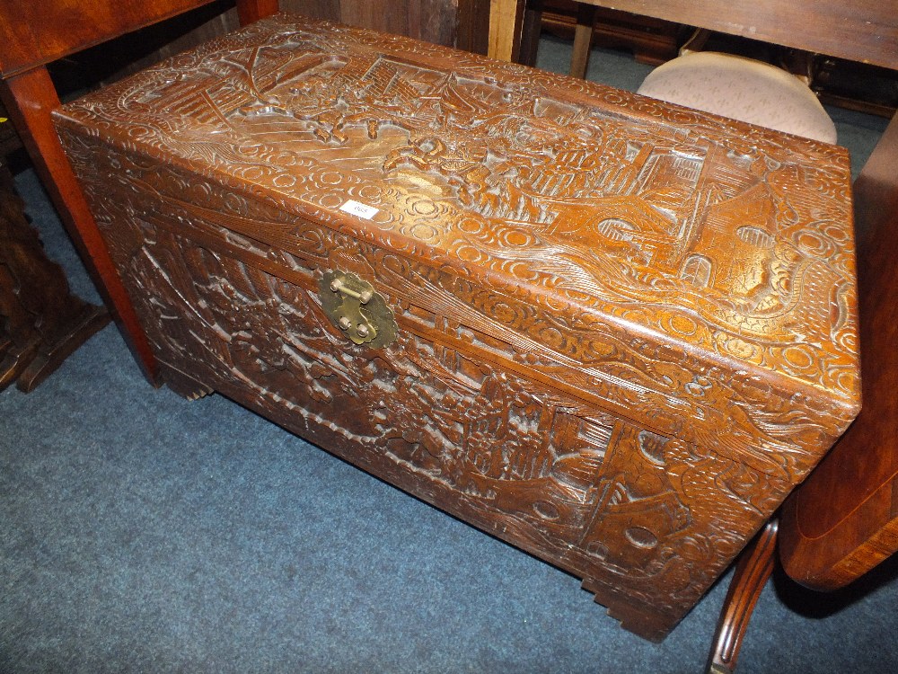 AN EASTERN CARVED CAMPHORWOOD CHEST