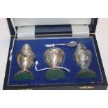 A CASED SET OF VINTAGE HALLMARKED SILVER CRUET SET