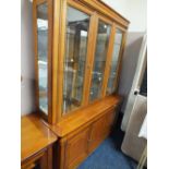 A MODERN CHERRY WOOD GLAZED BOOKCASE