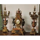 A CAST BRASS FRENCH STYLE CLOCK GARNITURES A/F WITH KEY