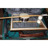 A LARGE SUITCASE CONTAINING A SELECTION OF BAGS, POLO MALLET, TAMBOURINE, MIRROR, ETC