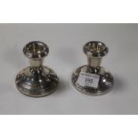 A PAIR OF HALLMARKED SILVER CANDLESTICK HOLDER